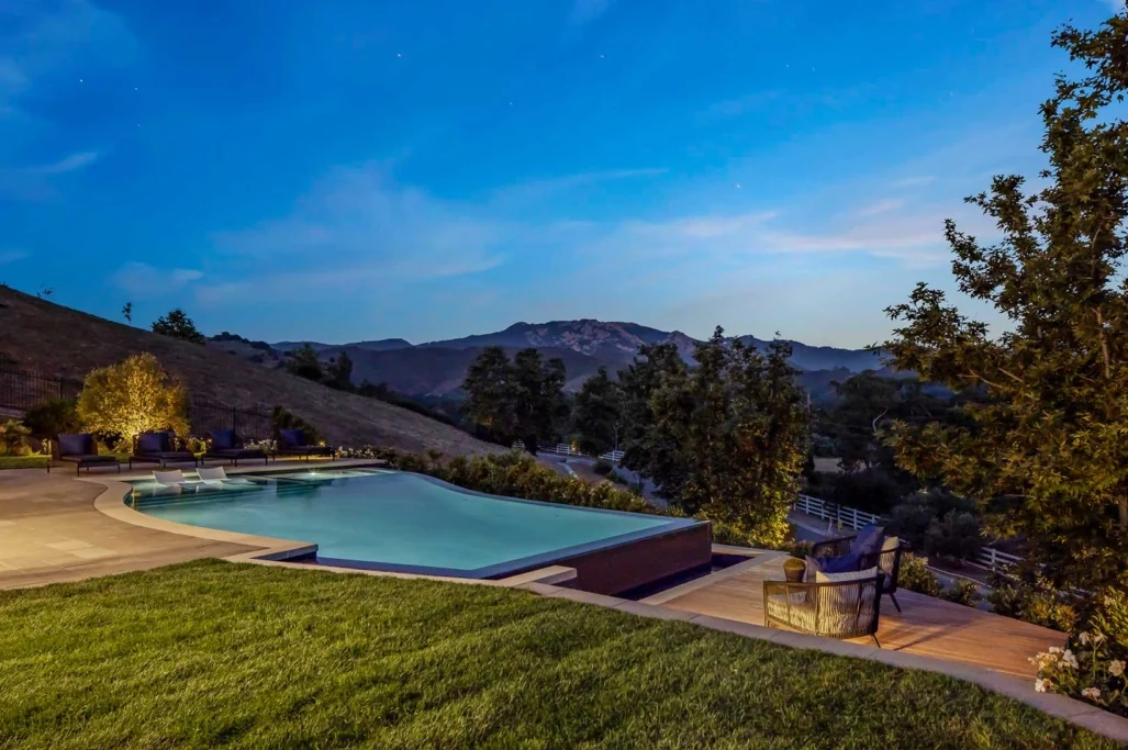 Infinity pool at dusk with canyon views
