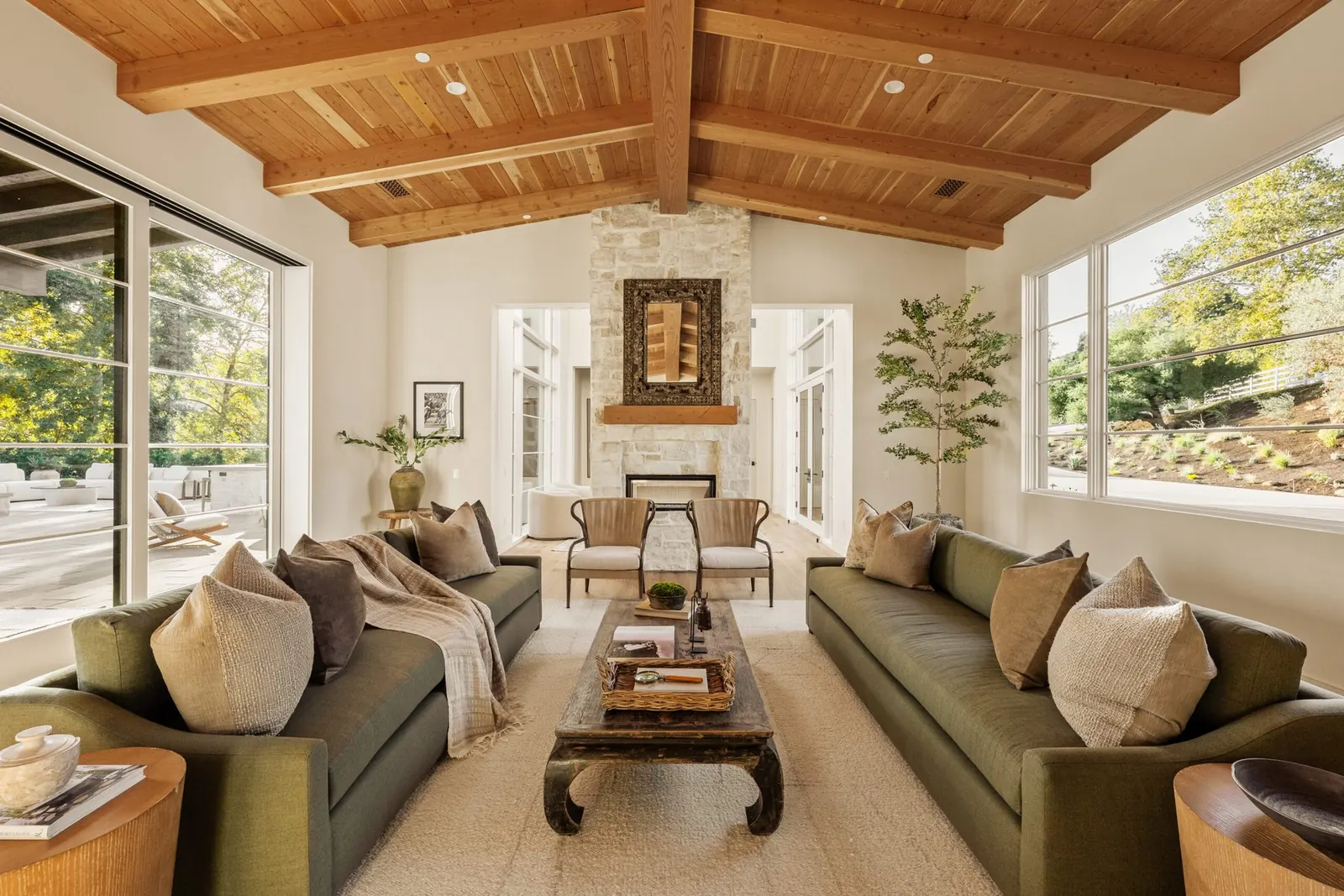 Living room with vaulted wood ceilings